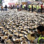 Volunteers prepare food to serve the families for first grant 'Sehri' during the holy fasting month of Ramzan ul Mubarak, free meal distribution by a JDC Foundation Pakistan near the mausoleum of the Quaid-i-Azam, Numaish Chowrangi