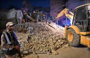 Rescue workers busy in rescue operation to pull out the owner of the house Teacher Naeemullah Baloch, who is trapped in the rubble after house collapsed in Sheikh Mohalla of Larkana city on late Tuesday Night.
