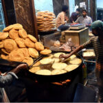 Vendors prepare traditional food item Phani in preparation of the first day of the holy month of Ramadan
