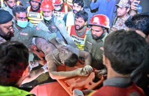 Rescue workers busy in rescue operation to pull out the owner of the house Teacher Naeemullah Baloch, who is trapped in the rubble after house collapsed in Sheikh Mohalla of Larkana city on late Tuesday Night.