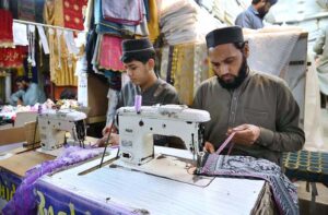 Eid Preparations in Full Swing as Tailors at Gora Bazar work tirelessly, doubling their efforts to meet the festive demand for new clothes ahead of Eid ul-Fitr