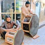 Artisan carpenters craft beautiful, stylish tables from wood to export and trade across the country