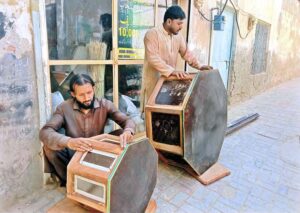 Artisan carpenters craft beautiful, stylish tables from wood to export and trade across the country