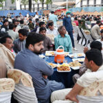 A large number of people sitting for monthly Iftar program at Allama Iqbal Teaching Hospital
