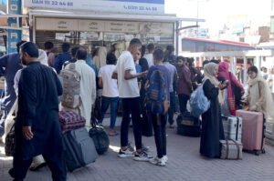 People at the bus terminal at Chowk Yatim Khana leaving for their hometowns to celebrate Eid-ul-Fitr with the loved ones