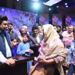 Sindh Governor, Kamran Khan Tessori greets the 120 yards plot lucky draw beneficiary Nadia Iqbal