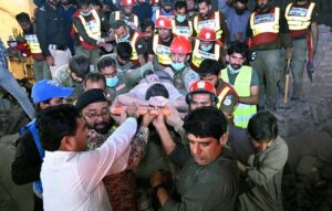 Rescue workers busy in rescue operation to pull out the owner of the house Teacher Naeemullah Baloch, who is trapped in the rubble after house collapsed in Sheikh Mohalla of Larkana city on late Tuesday Night.