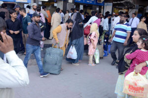 People at the bus terminal at Chowk Yatim Khana leaving for their hometowns to celebrate Eid-ul-Fitr with the loved ones