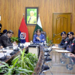 Federal Minister Hanif Abbasi is being briefed by the IG Railways Police on the performance of the Railway Police and the security of the Railways