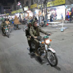 Women police personnel patrolling on a motorcycle, maintaining the law and order situation at Kutchery Bazaar