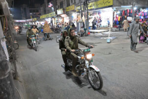 Women police personnel patrolling on a motorcycle, maintaining the law and order situation at Kutchery Bazaar