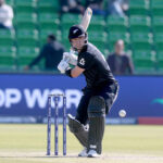 New Zealand batter Will Young playing shot during the ICC Champions Trophy one-day international (ODI) Semi-Final cricket match against South Africa at the Gaddafi Stadium