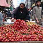 Vendor displaying strawberries to attract the customers during Iftar in the Holy Fasting month of Ramzan ul Mubarak