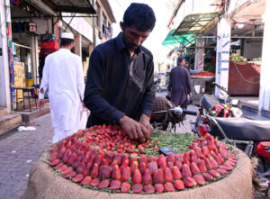 A vendor display and sells strawberry during holy fasting month of Ramadan at Aabpara in the Federal Capital