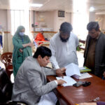 Doctor checking list of injured to provide information to the relatives of Railway employees at Civil Hospital Trauma Center who has been injured in Bolan terrorist attack incident
