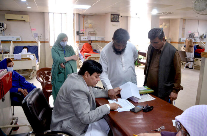 Doctor checking list of injured to provide information to the relatives of Railway employees at Civil Hospital Trauma Center who has been injured in Bolan terrorist attack incident