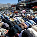 Worshipers offering prayers of last Friday in the holy month of Ramzan at Meezan Chowk