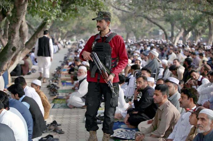 Security personnel standing high alert during Eidul Fitr prayers at Eidgah