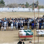Syed Mazhar Ali Shah Secretary, Chairman Railways Islamabad along Muhammad Tahir Rai, HST, SI, PSP Inspector General Pakistan Railway Police CPO, Lahore and other railway officers offering funeral prayers of two martyrs railway personnel during terrorist attack on Jaffar Express near Bolan, at Railway Hockey ground