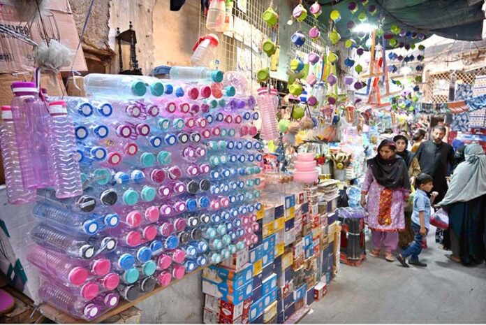 A view of encroachments on a wall of Resham Gali street by a shopkeeper, causing inconvenience to women who come to Reshma Gali for upcoming Eid-ul-Fitr shopping and needs the attention of concerned authorities