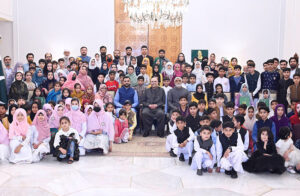 President Asif Ali Zardari in a group photo with the orphaned children during the Iftar Dinner hosted by him, at Aiwan-e-Sadr