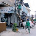PTCL workers are trying to fix the fault in internet service line