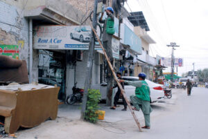 PTCL workers are trying to fix the fault in internet service line
