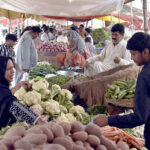 People buying vegetables on subsidy rates at special Ramadan Bazar near Shadman Town