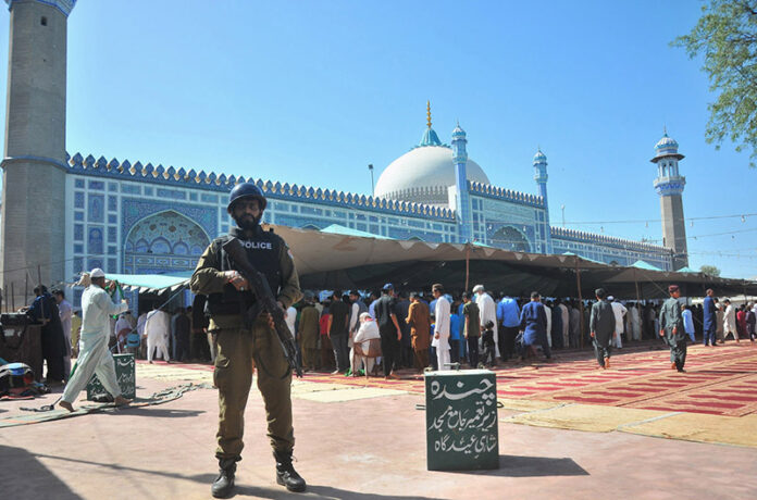 Security personnel standing high alert at Eidgah Masjid during Namaz-e-Juma-tul-Wida (Friday’s Prayer) in the fasting month of Ramzan