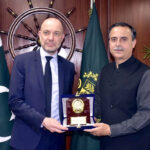 Federal Minister for Maritime Affairs, Muhammad Junaid Anwar Chaudhry, presents a souvenir to the Ambassador of Denmark, Jakob Linulf, during their meeting on bilateral Maritime Cooperation