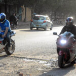 Youngsters enjoying riding heavy bikes near Governor House