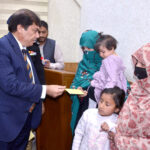 Federal Minister for Pakistan Railway Hanif Abbasi distributing cash cheques among widows of Railway employees at Quetta Railway Divisional Superintendent Office who had been martyred in Jaffar Express incident near Bolan