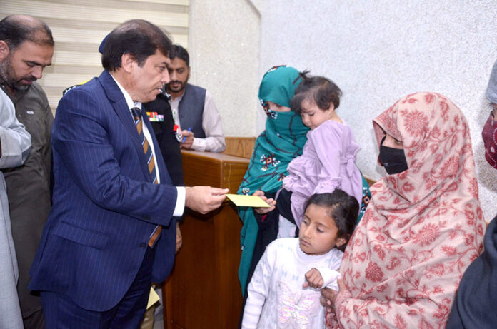 Federal Minister for Pakistan Railway Hanif Abbasi distributing cash cheques among widows of Railway employees at Quetta Railway Divisional Superintendent Office who had been martyred in Jaffar Express incident near Bolan Federal Minister for Pakistan Railway Hanif Abbasi distributing cash cheques among widows of Railway employees at Quetta Railway Divisional Superintendent Office who had been martyred in Jaffar Express incident near Bolan