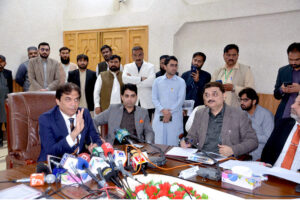 Federal Minister for Pakistan Railway Hanif Abbasi distributing cash cheques among widows of Railway employees at Quetta Railway Divisional Superintendent Office who had been martyred in Jaffar Express incident near Bolan