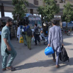 People heading to the bus station leaving for their home town to celebrate Eid ul Fitr festive with their lovedones