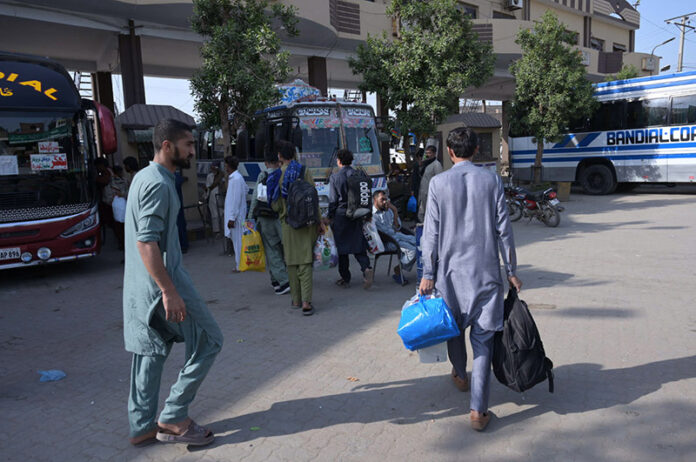 People heading to the bus station leaving for their home town to celebrate Eid ul Fitr festive with their lovedones