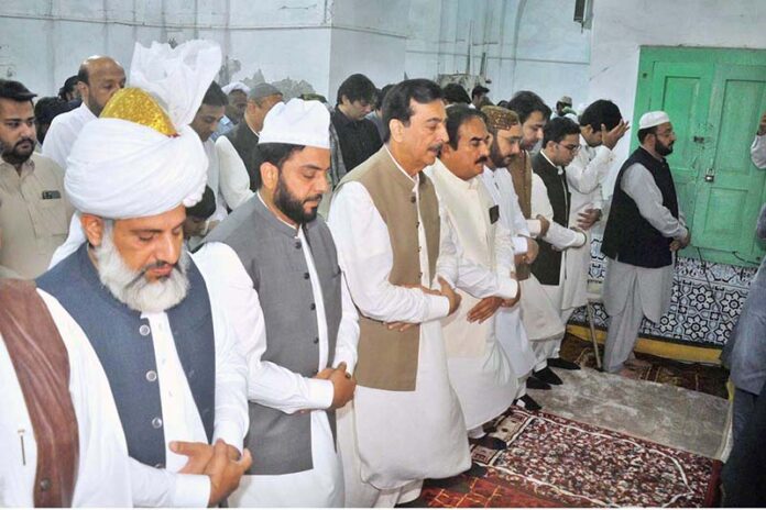 Chairman Senate Syed Yusuf Raza Gilani offers the Eidul Fitr prayers at the shrine of Musa Pak Shaheed