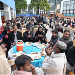 A large number of people offering Dua before breaking their fast at Allama Iqbal Memorial Teaching Hospital