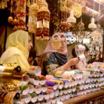 Women buying bangles at market in preparation of Eid-ul-Fitr in the City