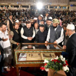 Federal Minister for Parliamentary Affairs Dr. Tariq Fazal Chaudhry and Turkish Ambassador to Pakistan Irfan Neziroglu watching a historic copy of the Holy Quran gifted by Turkiye to Pakistan on display at Faisal Mosque