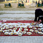Volunteers arranging free Iftar for the nearby people at a local park in Melody area in the fasting month of Ramadan ul Mubarak