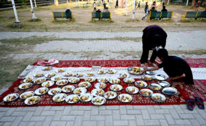 Volunteers arranging free Iftar for the nearby people at a local park in Melody area in the fasting month of Ramadan ul Mubarak