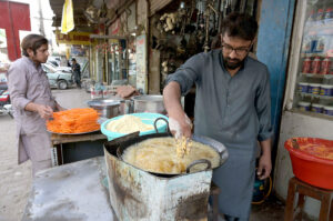 A vendor making Pakora commonly used during Iftar in the fasting month of Ramadan.