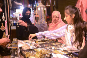 Women buying bangles at market in preparation of Eid-ul-Fitr in the City