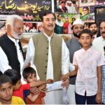 Chairman Senate Syed Yusuf Raza Gilani distributing Eidi and gifts among the orphan children during his visit to SOS Village