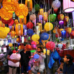 A vendor displaying colorful lights for decoration at Shah Alam Market in the Provincial Capital