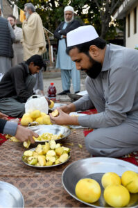 Volunteers arranging free Iftar for the nearby people at a local park in Melody area in the fasting month of Ramadan ul Mubarak