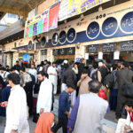 A large number of people purchasing tickets leaving for their hometowns at Faizabad Bus Stand to celebrate Eid ul fitr festive with their loved ones