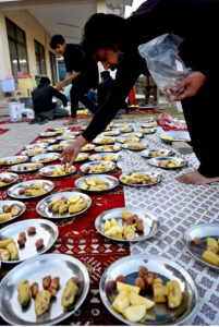 Volunteers arranging free Iftar for the nearby people at a local park in Melody area in the fasting month of Ramadan ul Mubarak
