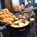 A shopkeeper preparing Pheniya late night in Krishna Nagar Chowk due to the increased demand during holy Ramadan